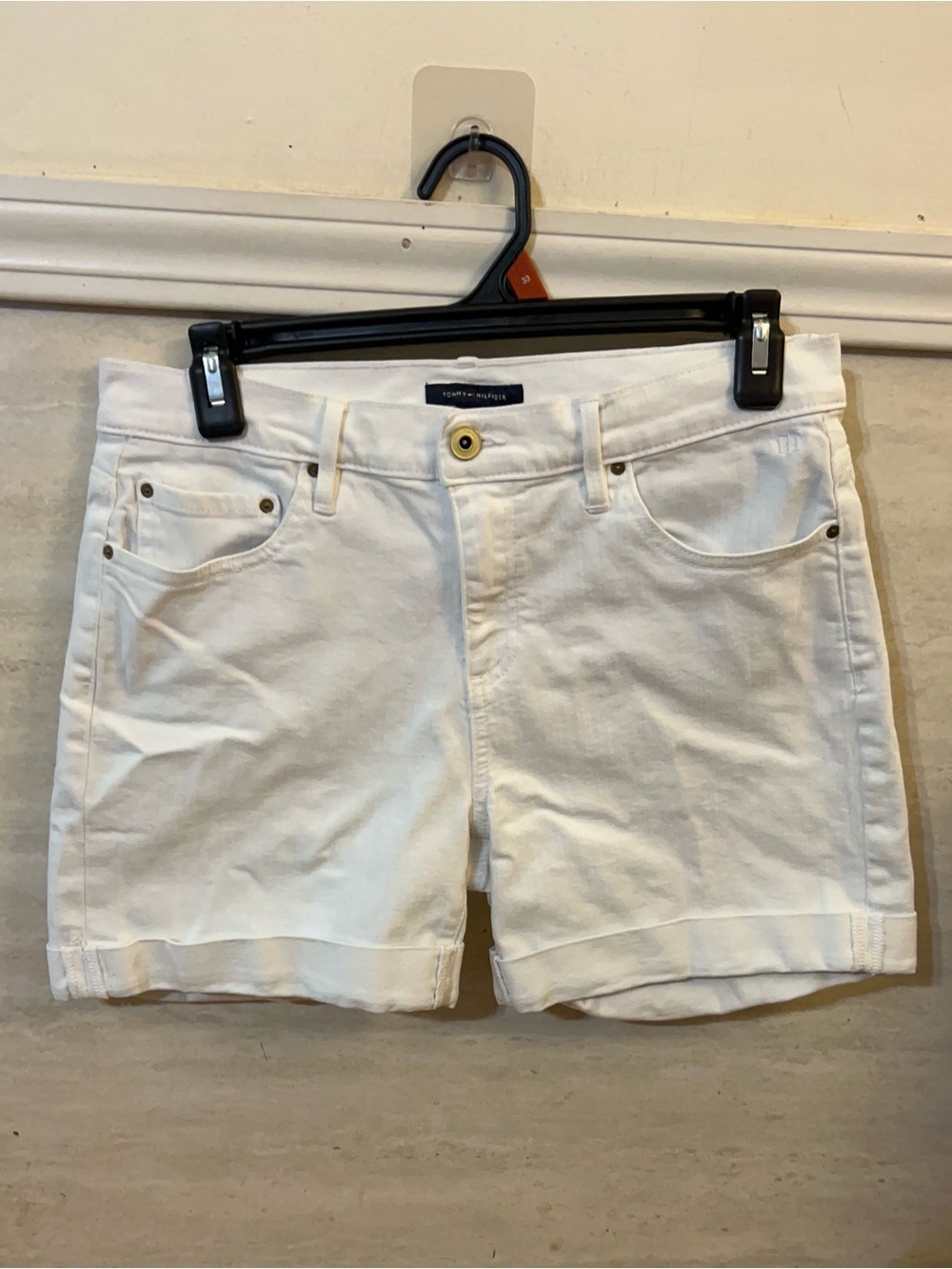 Tommy Hilfiger women's white denim shorts with a cuffed hem.